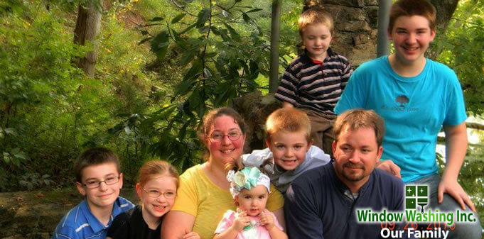 Tony Locke and Justin Schriner — owners of Window Washing Inc, with family
