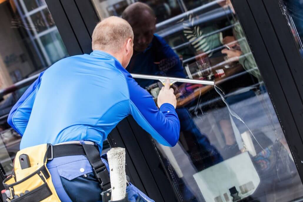 Squeegee gliding across a clean window